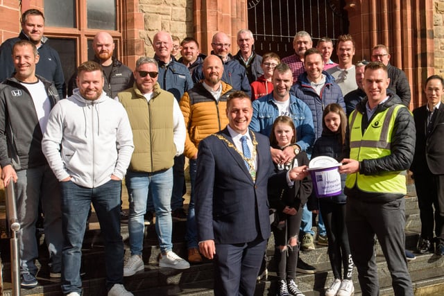 The Mayor Alderman Graham Warke and Christopher Cooper from Foyle Down Syndrome Trust with the super car owners during Super Car Sunday in aid of the Mayorâ€TMs Charity Appeal for Foyle Down Syndrome Trust. Picture Martin McKeown. 03.10.21