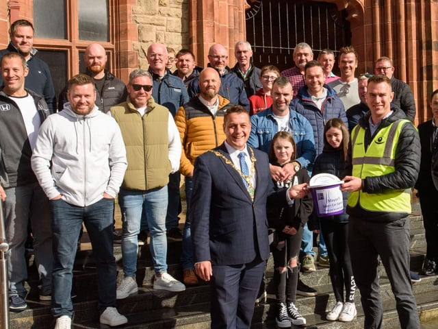 The Mayor Alderman Graham Warke and Christopher Cooper from Foyle Down Syndrome Trust with the super car owners during Super Car Sunday in aid of the Mayorâ€TMs Charity Appeal for Foyle Down Syndrome Trust. Picture Martin McKeown. 03.10.21
