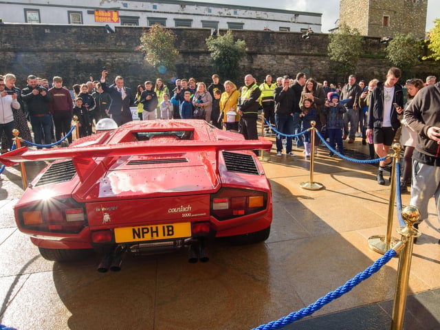 Part of the crowd who came to Guildhall square to admire the cars during Super Car Sunday in aid of the Mayorâ€TMs Charity Appeal for Foyle Down Syndrome Trust. Picture Martin McKeown. 03.10.21