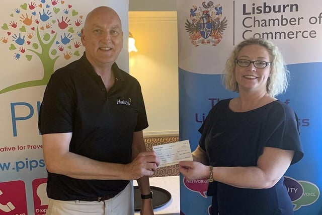 Renee Quinn from suicide prevention charity, PIPS is presented with a cheque by President, Garry MacDonald from proceeds raised at the recent Chamber 60th Anniversary Golf Day