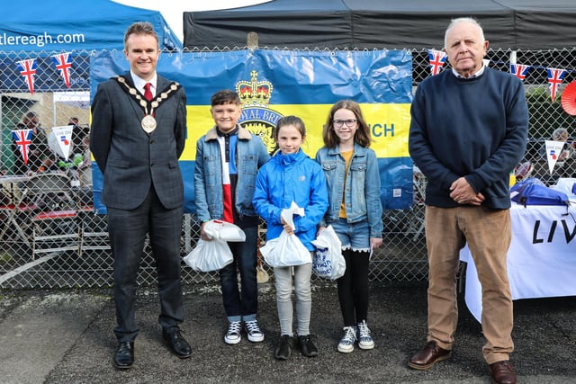 Prize winners from the 'Poppies, Old Soldiers and Old Buildings' drawing competition, which was open to local primary school children. They are pictured with Mayor Alderman Stephen Martin and Legion Branch Chairman Brian Sloan. Pic by Norman Briggs, rnbphotographyni