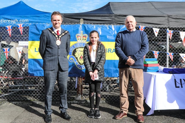 One of the art competition winners, is pictured with Mayor Alderman Stephen Martin and Chairman of the Lisburn Royal British Legion Brian Sloan. Pic by Norman Briggs, rnbphotographyni