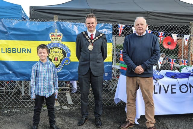 One of the art competition winners, is pictured with Mayor Alderman Stephen Martin and Chairman of the Lisburn Royal British Legion Brian Sloan. Pic by Norman Briggs, rnbphotographyni