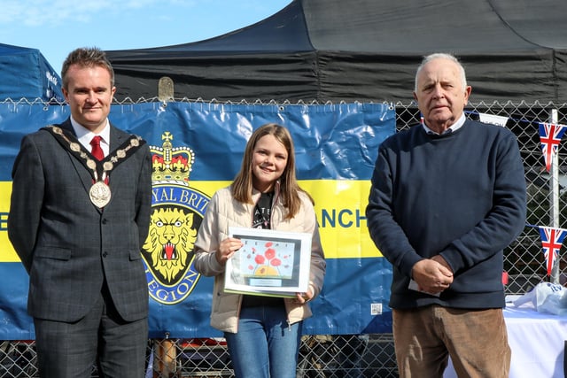 Cara  from Killowen PS, one of the art competition winners, is pictured with Mayor Alderman Stephen Martin and Chairman of the Lisburn Royal British Legion Brian Sloan. Pic by Norman Briggs, rnbphotographyni