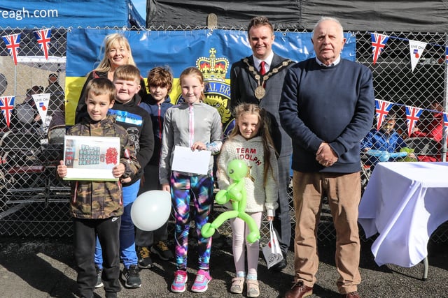 Prize winners from the ‘Poppies, Old Soldiers and Old Buildings’ drawing competition, which was open to local primary school children. They are pictured with Mayor Alderman Stephen Martin and Legion Branch Chairman Brian Sloan. Pic by Norman Briggs, rnbphotographyni