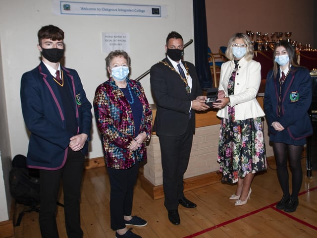 Dr Anne Murray, Chair, BOG and Katrina Crilly, Principal, make a presentation to the Mayor, Graham Warke during last weekâ€TMs Annual Senior Awards. Included are Head Boy Dara and Head Girl Saran. (Photos: JIm McCafferty Photography)