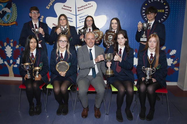 Oakgrove Integrated Collegeâ€TMs Vice Principal Conal Donaghy pictured with Prizewinners for excellence in GCSE.