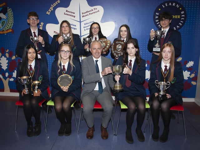 Oakgrove Integrated Collegeâ€TMs Vice Principal Conal Donaghy pictured with Prizewinners for excellence in GCSE.