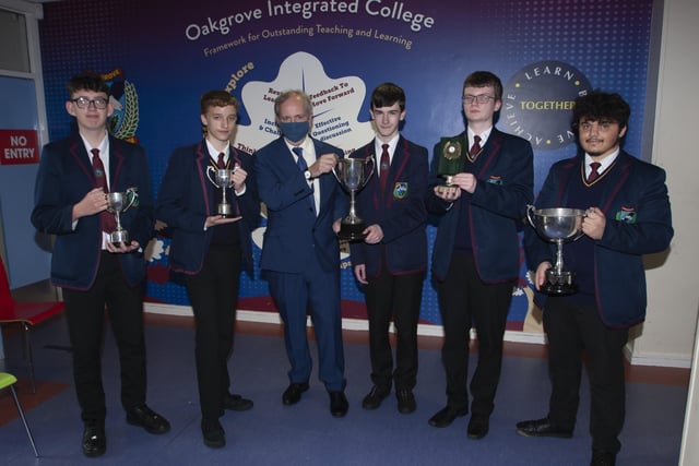 Matthew, Jonathan,  Aaron and Cahir receive awards for excellence in GCSE Geography, English Literature, Further Mathematics and English, pictured with Vice Principal John Harkin.
