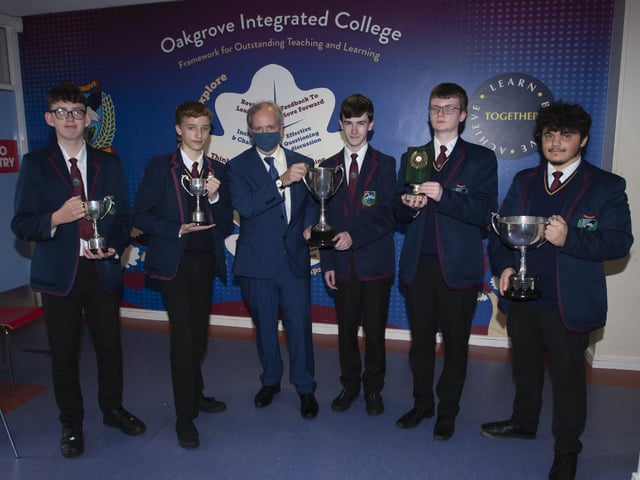 Matthew, Jonathan, Aaron and Cahir receive awards for excellence in GCSE Geography, English Literature, Further Mathematics and English, pictured with Vice Principal John Harkin.