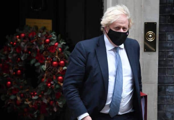 Boris Johnson has now introduced Plan B Covid restrictions, including asking people to work from home, making face masks mandatory in more locations and requiring vaccine passports for nightclubs and events venues. Photo by Chris J Ratcliffe/Getty Images.