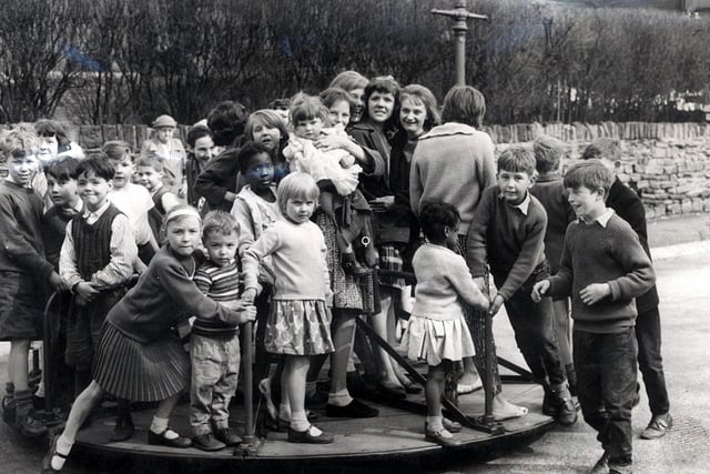Children on a packed roundabout at Countess Road playground, Sheffield, on April 24,1962