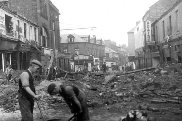 The bombs fell on Saville Street in September 1941 but locals were soon getting stuck into the clear-up operation.