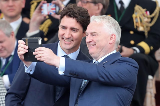 Canadian Prime Minister Justin Trudeau (L) poses for a selfie photograph with Leader of Portsmouth City Council Gerald Vernon-Jackson during the event. Picture: CHRIS JACKSON/AFP/Getty Images