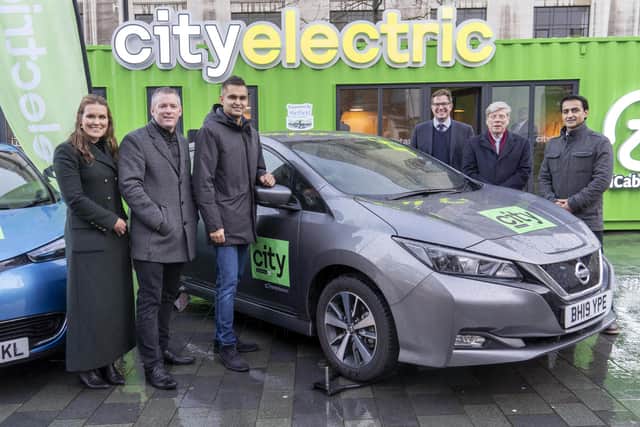 Launch of the City Taxis goes electric plan in December.From left: Sinead Gillett and Gavan Walsh of icabbi, Arnie Singh and Davud Aryan of City Taxis, Mick Tope icabbi and Neil Davies RCI bank and services. Picture Scott Merrylees
