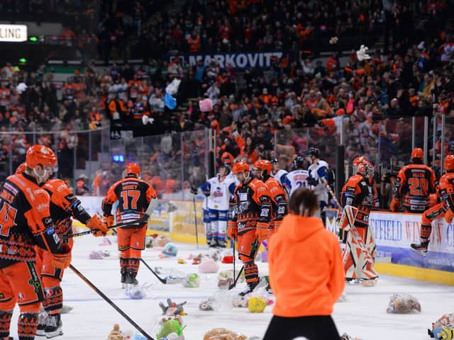 The chaos of the teddy bear toss. (Dean Woolley)
