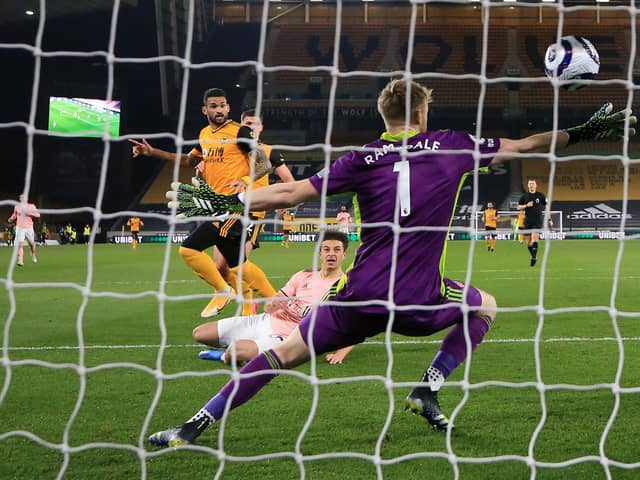 Wolverhampton Wanderers' Brazilian striker Willian José (centre left) scores the opening goal of the English Premier League football match between Wolverhampton Wanderers and Sheffield United at the Molineux stadium in Wolverhampton, central England on April 17, 2021. (Photo by Catherine Ivill / POOL / AFP) / RESTRICTED TO EDITORIAL USE. No use with unauthorized audio, video, data, fixture lists, club/league logos or 'live' services. Online in-match use limited to 120 images. An additional 40 images may be used in extra time. No video emulation. Social media in-match use limited to 120 images. An additional 40 images may be used in extra time. No use in betting publications, games or single club/league/player publications. /  (Photo by CATHERINE IVILL/POOL/AFP via Getty Images)
