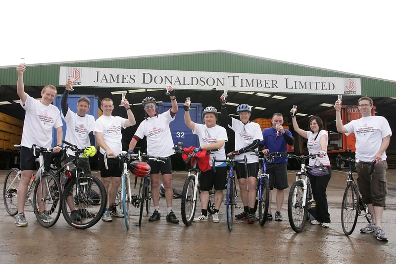 Team Donaldson celebrate as they complete the final leg of the Donaldson Challenge 2011 at the James Donaldson Timber sawmill in Leven
