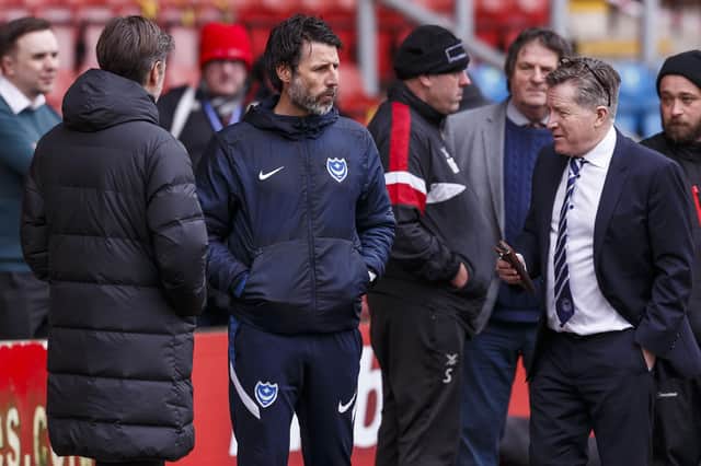 Pompey boss Danny Cowley, centre, with brother Nicky, left, and chief executive Andy Cullen after the decision to cancel today's game at Gresty Road was made     Picture: Daniel Chesterton/phcimages.com)