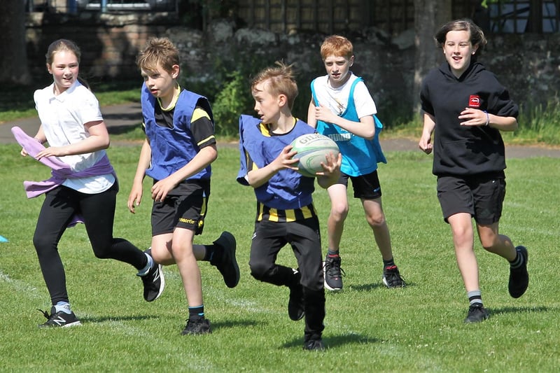 The town's kids enjoyed the outdoor activity day, which included touch rugby.