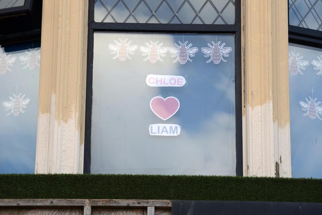 A window decorated with the Manchester bee symbol to remember Chloe and Liam.