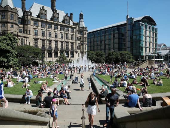 Sheffielders in the Peace Gardens basks in the warm summer sunshine