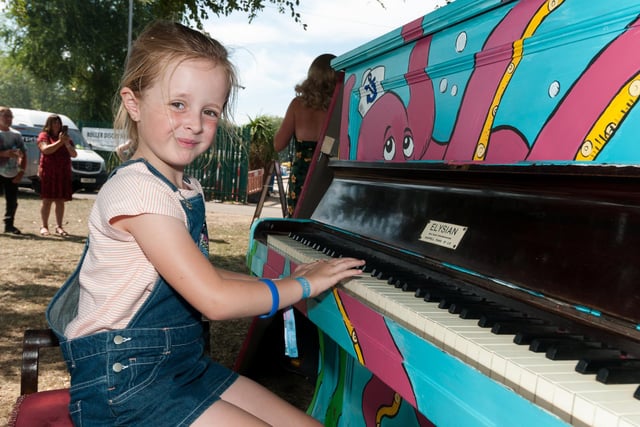 Amelie Cross (7yrs) tries her hand at the piano during Victorious Festival in 2019.