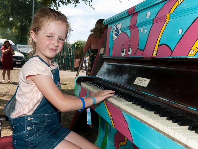 Amelie Cross (7yrs) tries her hand at the piano during Victorious Festival in 2019.