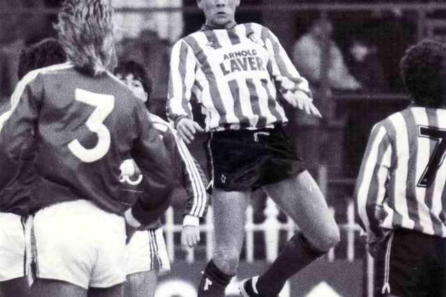New signing - and a fresh faced - Chris Wilder in action for United against Brighton & Hove Albion in January 1987.