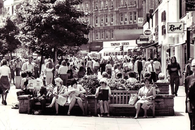 Lunchtime weather picture.  People relaxing in the sun in Fargate in 1976