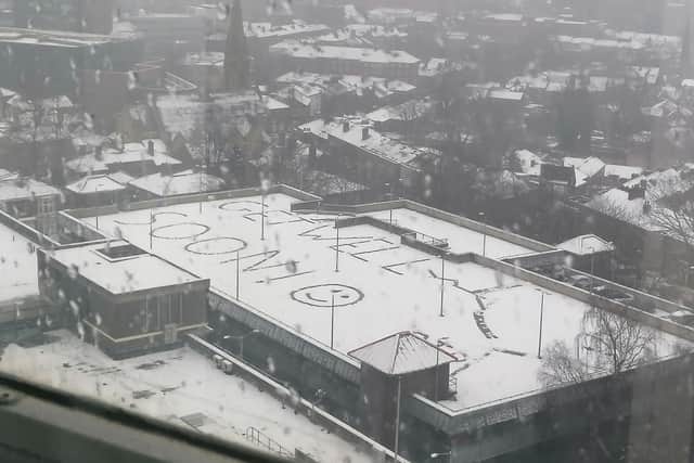 Patients got to look out the windows at Royal Hallamshire Hospital today (March 9) to see someone had written "get well soon" in the snow on the multi-storey car park.