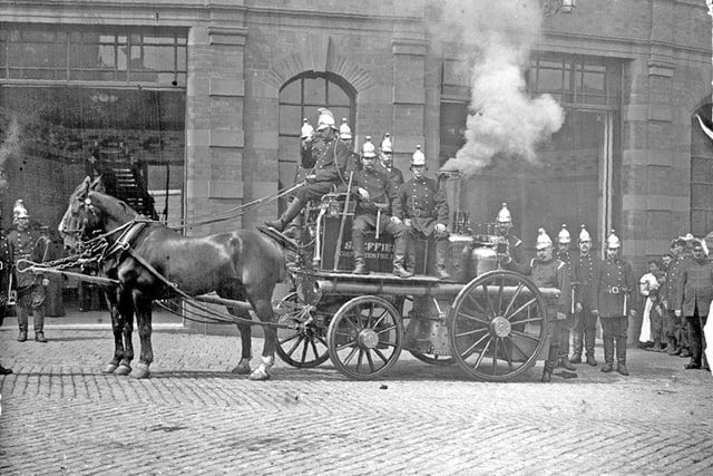 A steam-powered engine outside West Bar in the 1900s. These vehicles were kept constantly in steam, which made the station both hot and dirty