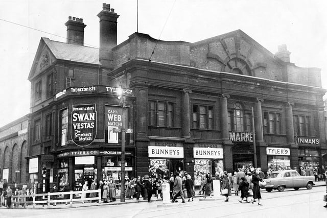 The Norfolk Market Hall, Haymarket, opened on Christmas Eve 1851 and closed in 1959.  It was built on the site of the famous old Tontine Inn (1785-1849). From right to left the shops are G.E. Inman, pastry cooks,  Tyler's, bootmakers,  Bunneys (Hosiery) Ltd., drapers, and the popular tobacconists, Tyler and Co. on the corner with Exchange Street, Sheffield