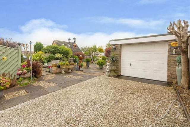 This sizeable, sturdy and stylish garage is an added bonus for potential buyers. It is at the end of a long driveway.