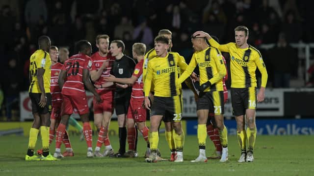 Burton celebrate their second goal as Rovers remonstrate with the official. Picture: Howard Roe/AHPIX