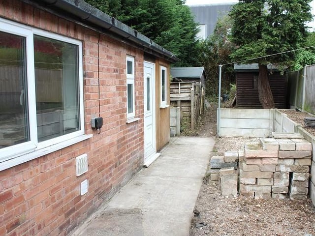 Step outside the back door on to this neat patio area. Not hard to envisage sitting outside with a cup of coffee.