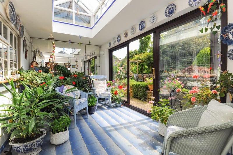 The garden room boasts a roof lantern and large sliding doors opening to the beautiful garden.