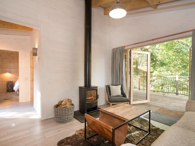 Despite opening as the seasons change and temperatures drop, each treehouse comes equipped with a wood-burning stove and cosy furnishings to keep out the cold. Don't forget that bath on the porch as well which you can enjoy outside.