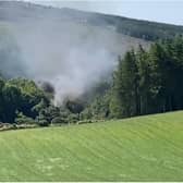 Smoke pours from the scene of the derailment near Stonehaven in Scotland. (Photo: BBC Scotland).