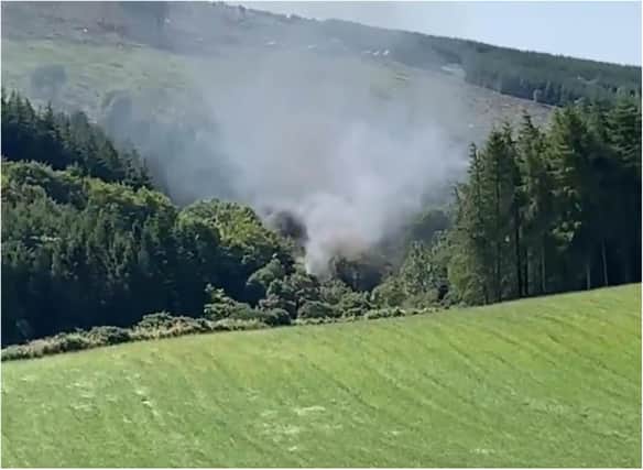 Smoke pours from the scene of the derailment near Stonehaven in Scotland. (Photo: BBC Scotland).