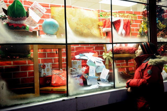 Jake Robinson, 7, is enjoying the Christmas window display at Swainston's Sweethearts in Whiteleas Way in 2014.