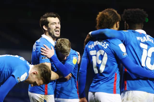 John Marquis celebrates his goal and Pompey's fourth of the match.