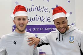 Sheffield Wednesday's Will Vaulks and Akin Famewo with a couple of Christmas hats edited on.