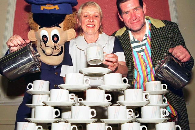 Helping to brew up funds for Menacp at Bentley Pavillion, Bentley, Doncaster, in 1998 were, from left, June Meanwell (Postman Pat), of Sprotbrough, Jackie Blackham (Alice in Wonderland), of Scawsby, and Ken Wilson (Mad Hatter), of Bentley, who organised the event.