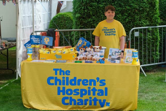 Volunteer Jack Cummings on the Charity Stall