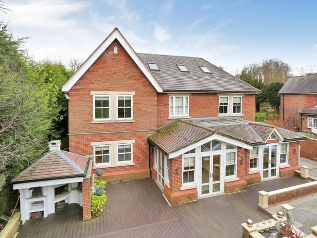 The exterior of the Linby Lane property is imposing from all angles. This photo shows a view from the back