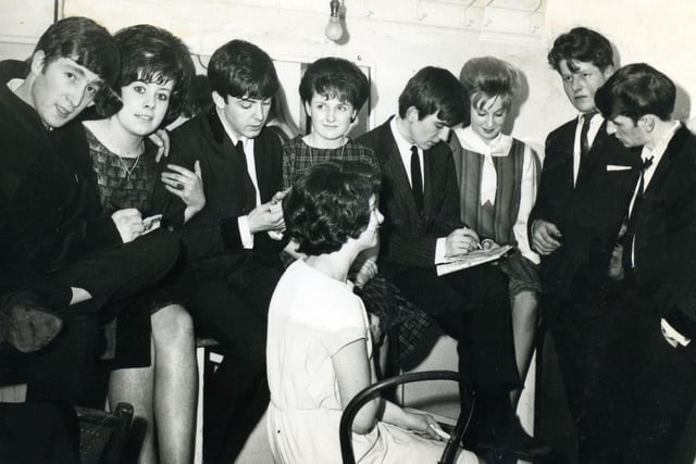 The Beatles pictured backstage with fans at the Royal Hall in Harrogate in 1963.