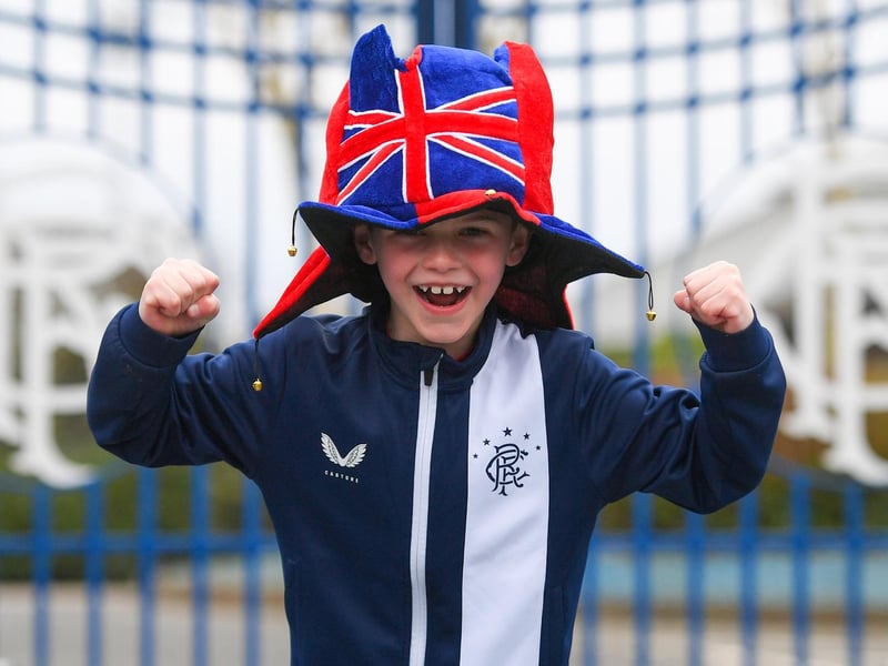 Alfie, aged 7, is pictured as Rangers fans gather outside Murray Park as they are crowned champions on March 07, 2021