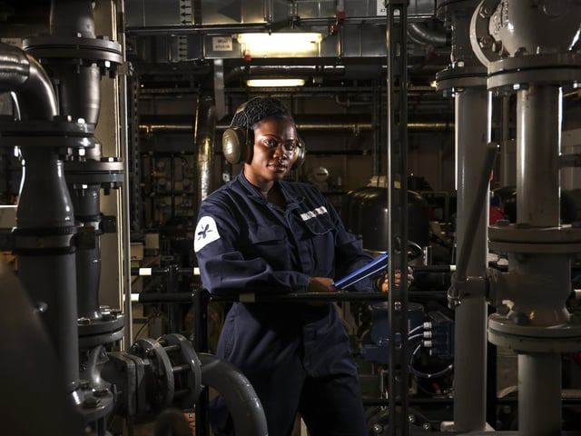 Pictured: Royal Navy Mechanical Engineer Benedicta Baidoo in her element.
HMS Prince of Wales has returned to sea for a spell of testing and trialling, following several months of maintenance and installing key equipment. HMS Prince of Wales is most capable and powerful surface warship ever built for the Royal Navy and will be a future flagship for the next 50 years.
The 73,000 tonnes ship and her crew will then proceed to the South West cost to conduct a period of Basic Operational Sea Training to test ship and crew capabilities. The intense operational training enables - Availability, Sustainability and Lethality of HMS Prince of Wales. The Ships Company are crucial to the successful operation of the ship and training and trials are essential in ensuring that HMS Prince of Wales is the cornerstone of a Modern, Ready and Global Navy for a Global Britain.
