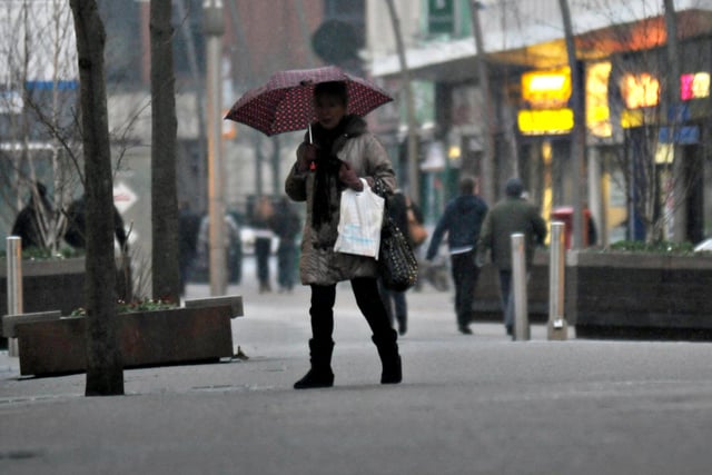 Shoppers on High Street West, Sunderland, as wet hail started to fall on freezing pavements in 2012.